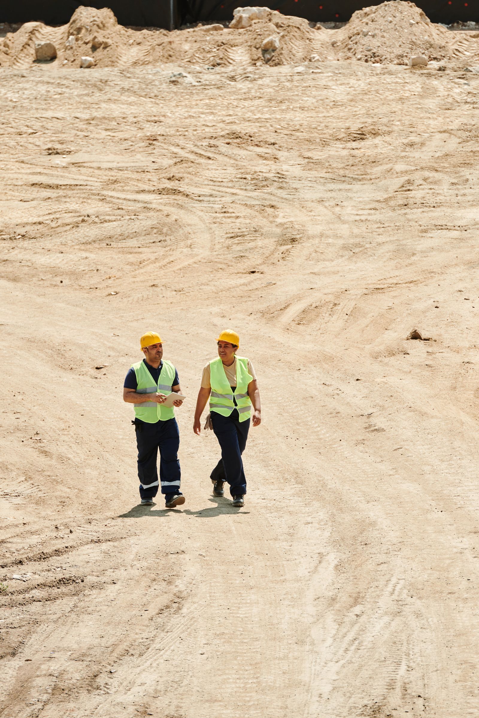 Construction worker in high-visibility safety vest and hard hat